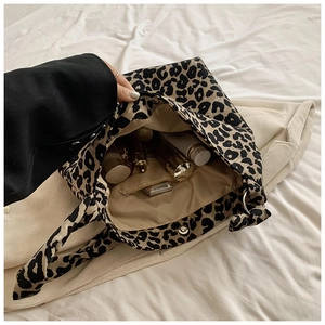 Top view of large leopard print canvas tote bag showing interior storage space and lining