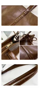 Détails du sac fourre-tout en cuir marron avec coutures précises et zip métallique