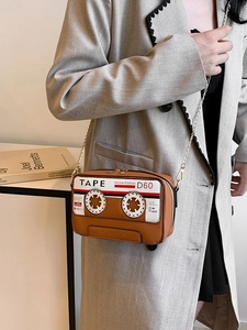 Retro cassette tape crossbody bag in brown leather with elegant gold chain strap