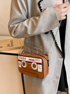 Unique tape-shaped crossbody bag in yellow PU leather with metal chain strap for women