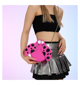 Detail of ladybug-shaped cartoon crossbody bag in pink with metallic chain strap