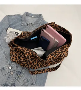 Detail of spacious leopard print tote bag interior showing ample storage for daily essentials