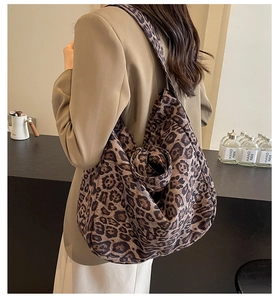 Leopard print canvas tote bag on female model showing oversized casual fit and vintage style