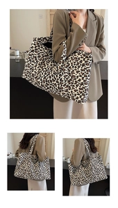 Detail of spacious leopard print tote bag featuring durable canvas and wide shoulder straps