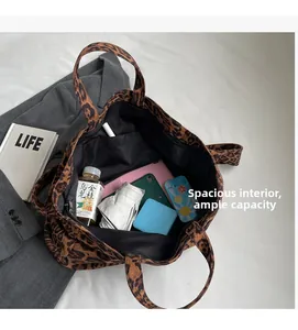 Detailed top view showing the spacious interior and large capacity of the leopard tote bag