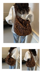 Detail of leopard print crossbody bag showing spacious design and canvas texture
