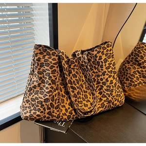 Detail of canvas leopard print tote bag with large capacity in a stylish home setting