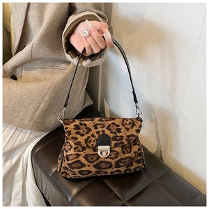 Detail of leopard print shoulder bag with silver turn-lock and luxury hair-on texture
