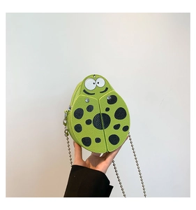 Detail of lime green ladybug PU leather crossbody bag with metal bead chain