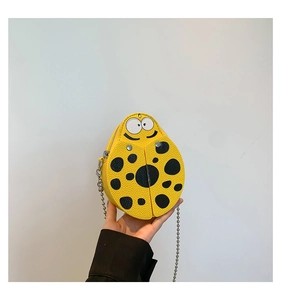 Mini ladybug crossbody bag with yellow lychee texture leather and silver chain strap