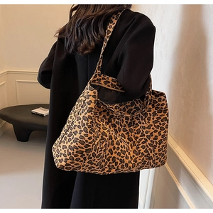 Detail of the large leopard print tote bag interior with black lining and zip pocket