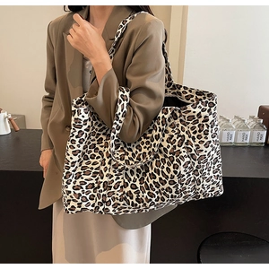 Detail view of the large capacity leopard print tote bag with double handle design
