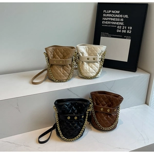 Detailed display of four quilted bucket bags in white, black, khaki and brown colors