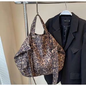 Close-up of leopard print canvas tote bag with long straps for casual daily style