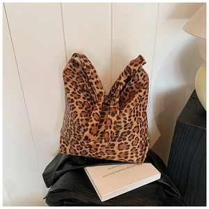 Macro shot of stylish leopard print fabric texture on a spacious tote bag for women