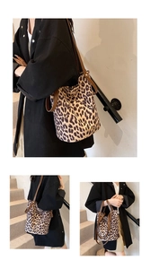 Leopard print bucket bag with brown handles shown in shoulder and hand-carry views