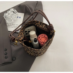 Leopard print tote showing interior capacity for smartphone, umbrella and cosmetics