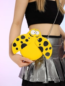 Round yellow PU leather crossbody bag with cartoon eyes and polka dot wing design