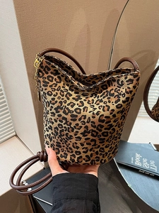 Leopard print tote bag for women featuring deep brown leather straps and gold chain detail