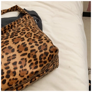 Close-up of leopard print canvas tote bag showing durable material and reinforced stitching