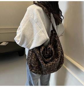 Close-up of leopard print shoulder bag with large capacity and stylish knot detail