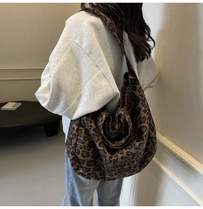 Close-up of a large leopard print tote bag with thick canvas texture for daily travel