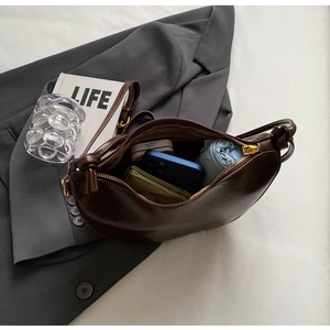 Interior view of large capacity dark brown hobo bag showing space for phone and wallet