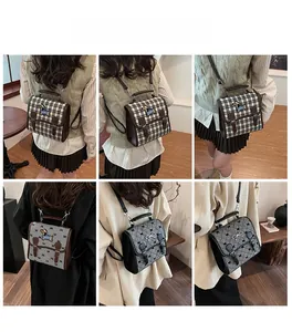Detail view of retro mini backpacks with plaid pattern and adjustable shoulder straps