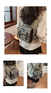 Detail view of vintage checkered backpack with cute dachshund embroidery and brown trim