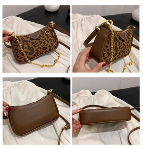 Detail view of leopard print texture and brown leather panels on women's handbag