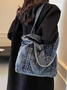 Retro deep blue denim tote bag for women with dual straps shown on a model