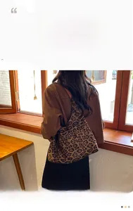 Detailed view of leopard print canvas tote bag featuring large capacity and soft texture