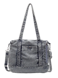 Retro washed denim tote bag with adjustable straps and front pocket on white background