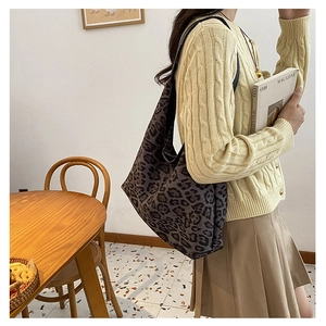 Detail shot of the large leopard print tote bag in a casual lifestyle setting