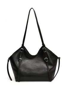 Retro black faux leather tote bag with silver buckle straps and a spacious interior