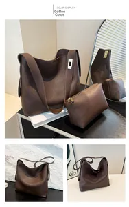 Detailed view of coffee brown lychee grain leather tote bag with matching storage pouch