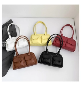 Flat lay of retro rectangle shoulder bags in five colors with textured faux leather