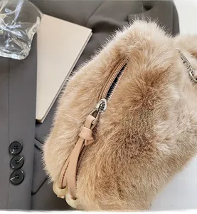 Detailed macro shot of smooth metal zipper and plush brown faux fur bag texture