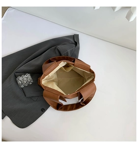 Top view of spacious interior of brown leather tote bag with functional inner side pocket