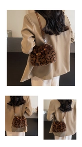 Detail of leopard print faux fur bucket bag with amber resin bead handle and leather strap