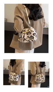 Close-up of leopard print faux mink bucket bag with yellow beads and white strap