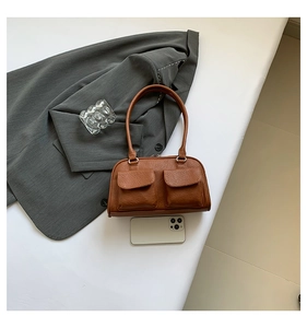 Brown vintage PU leather shoulder bag with double front pockets and phone size comparison