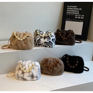 Collection of plush leopard and solid faux fur bucket bags with beaded handles