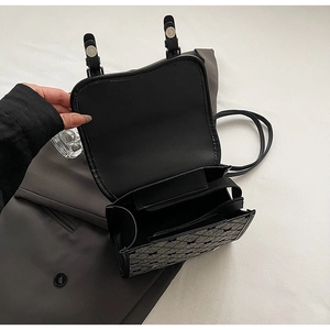 Detail view of internal three-layer compartment structure with zipper pocket on backpack
