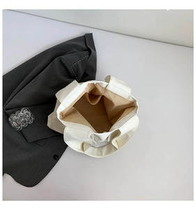 Top view of large white tote bag with lychee texture and organized inner compartments