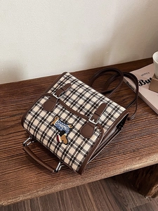 Japanese retro plaid backpack with dachshund embroidery on a vintage wooden bench