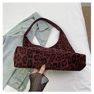 Detailed view of the burgundy leopard print hobo bag with soft velvet texture