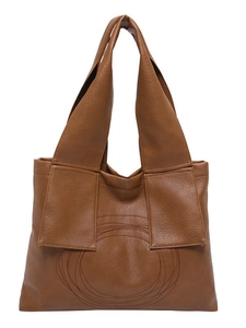 Brown faux leather tote bag with unique circular quilting and wide shoulder straps