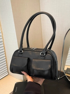 Vintage black faux leather underarm bag with double front flap pockets and soft texture