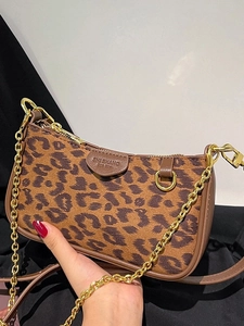 Chic leopard print underarm bag with gold chain strap and vintage contrast color design